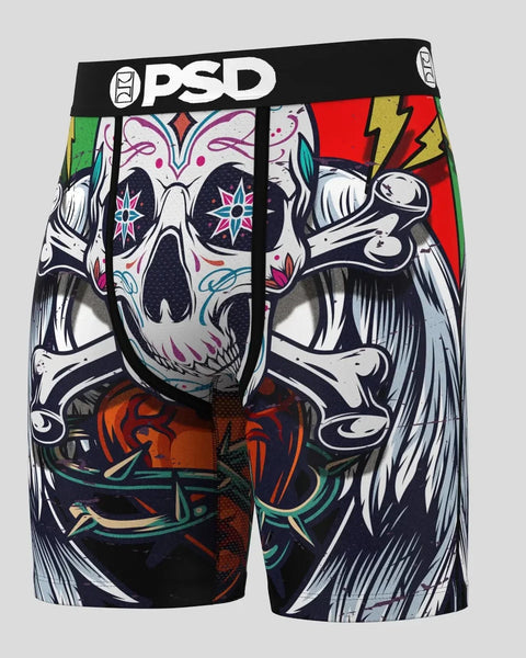 PSD brand boxer shorts with colorful skull and crossbones graphic print on black fabric.