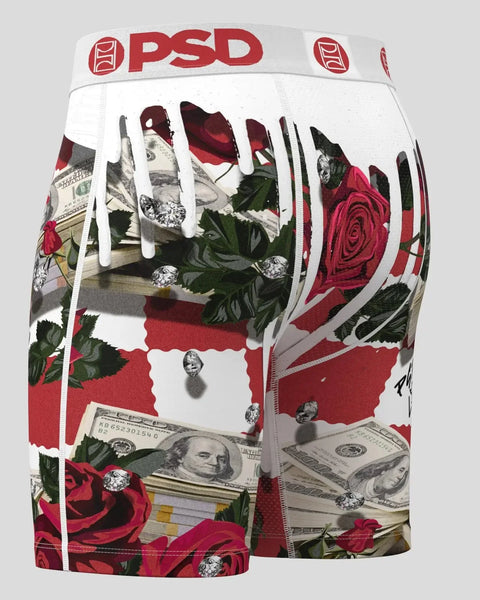 PSD boxer briefs with red roses, money, diamonds, and white drip graphics on checkered pattern.