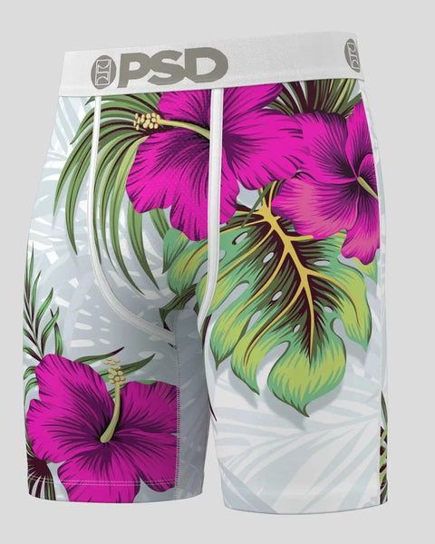 PSD brand boxer briefs with magenta hibiscus flowers and green palm leaf print on white background.