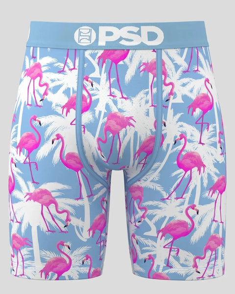 PSD boxer briefs with blue waistband featuring magenta flamingos and white palm fronds on light blue background.