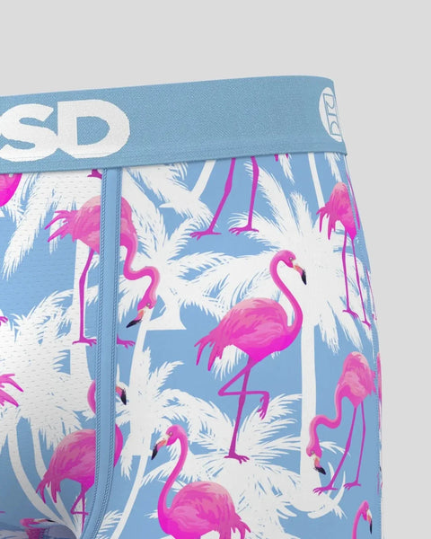 Blue waistband with white logo on boxer briefs featuring pink flamingos and white palm leaves throughout.