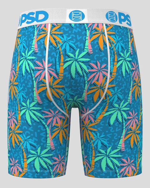 Teal boxer briefs with colorful palm leaves and bamboo print, white waistband with blue PSD branding.