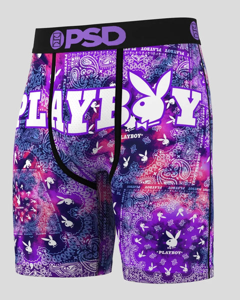 Three pairs of PSD boxer briefs in purple, pink, and navy with Playboy bunny logo, paisley patterns, and text graphics.