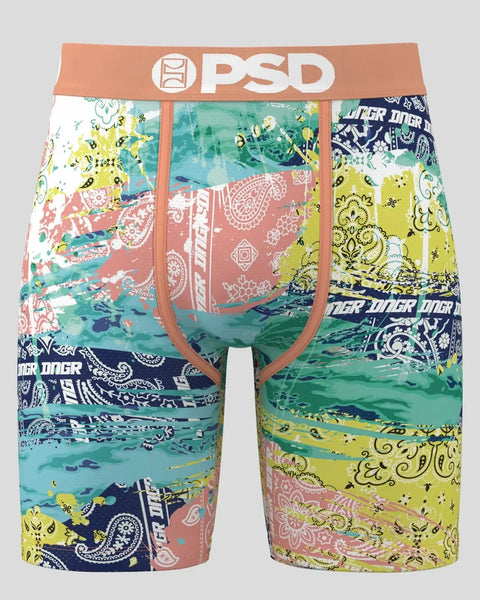 PSD boxer briefs with patchwork paisley and bandana patterns in turquoise, yellow, navy, and coral with orange waistband.