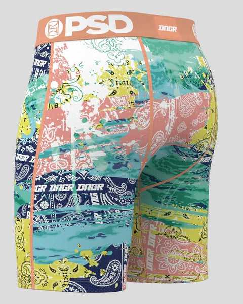 PSD men's boxer briefs with multicolored patchwork paisley and floral patterns in coral, yellow, green, and navy.