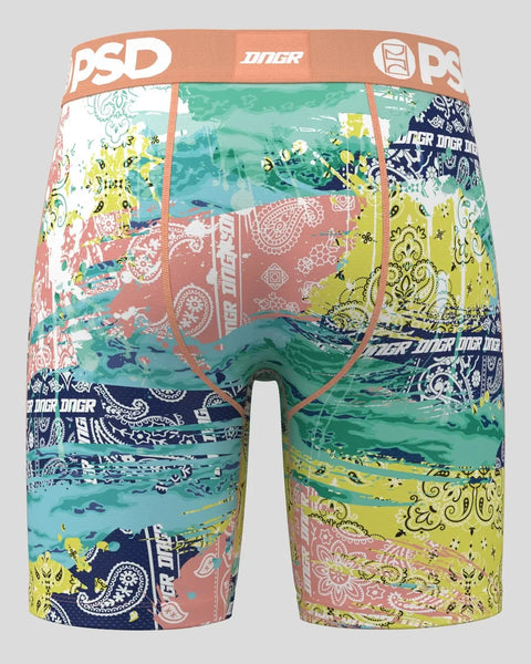 PSD boxer briefs with patchwork paisley print in green, yellow, coral, and navy with orange waistband.