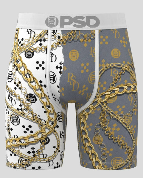 PSD boxer briefs with gold chain and monogram print on white and gray panels.