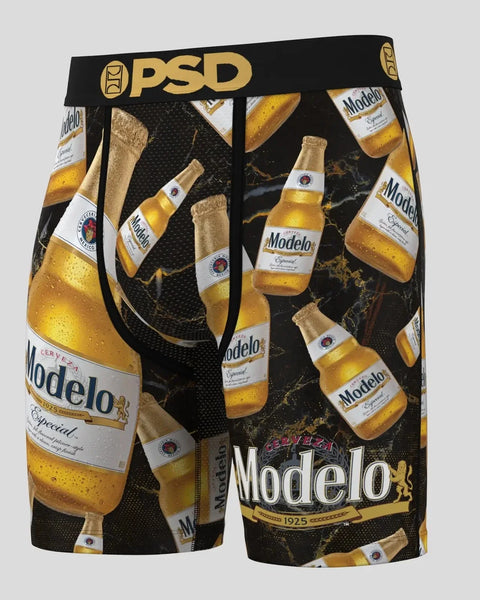 PSD black shorts with Modelo beer bottle and gold foil print design throughout.