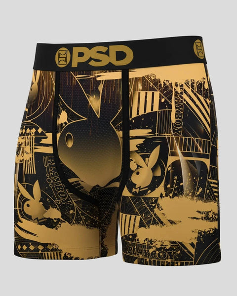 Black and gold boxer shorts with Playboy bunny logo and art deco geometric pattern throughout.