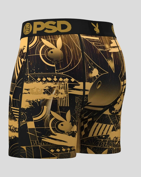 Black and gold boxer briefs with Playboy bunny logo and art deco-style geometric patterns throughout.