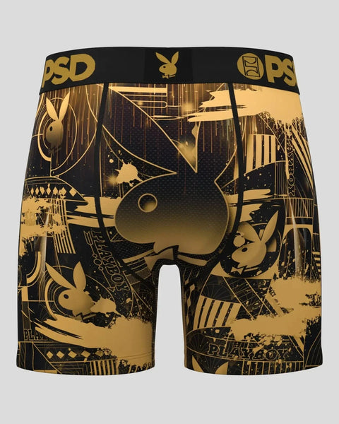 Black and gold boxer shorts with Playboy bunny logo and art deco geometric pattern throughout.