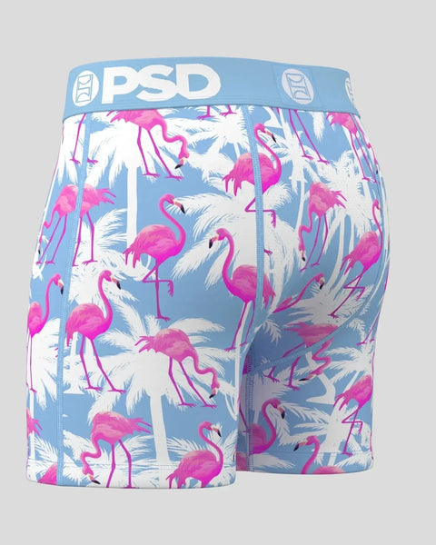 PSD branded boxer briefs with pink flamingos and white palm leaves on blue background.