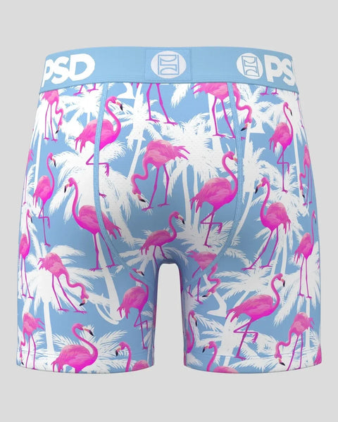 Men's boxer briefs with pink flamingos and white palm leaves on blue background, blue waistband with PSD branding.