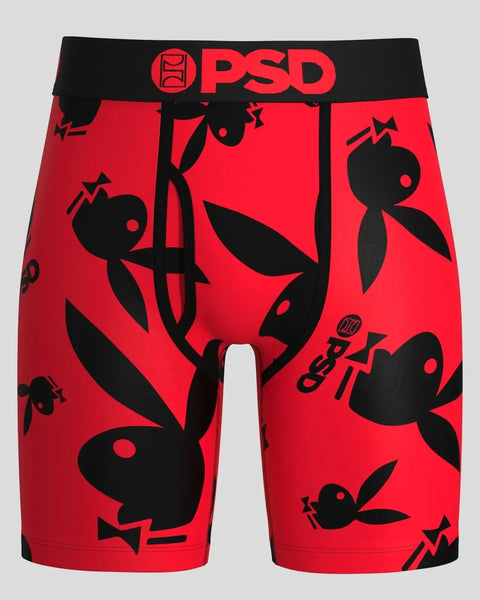 Red shorts with black waistband, PSD branding, and repeating Playboy bunny silhouettes throughout.