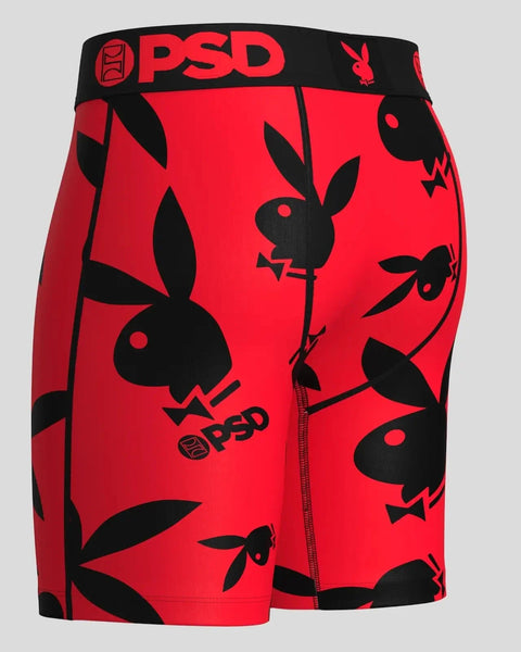 Red and black modal shorts with repeating Playboy bunny logo pattern throughout and PSD waistband.