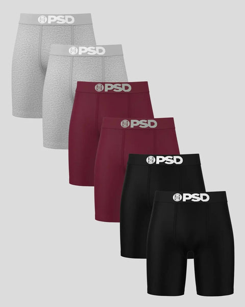 Six PSD boxer briefs in gray, burgundy, and black with branded waistband displayed in a staggered arrangement.