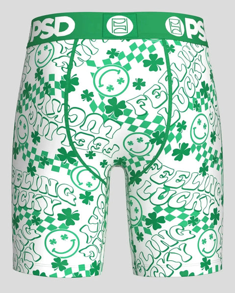 Green and white modal shorts with smiling faces, four-leaf clovers, and diamond pattern print, green waistband with PSD brand