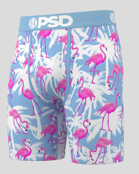 PSD boxer shorts with blue waistband featuring pink flamingos and white palm leaves on light blue background.
