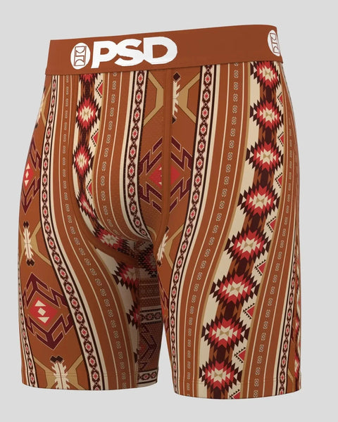 PSD brand boxer shorts with Aztec-inspired geometric pattern in rust, cream, and red tones.