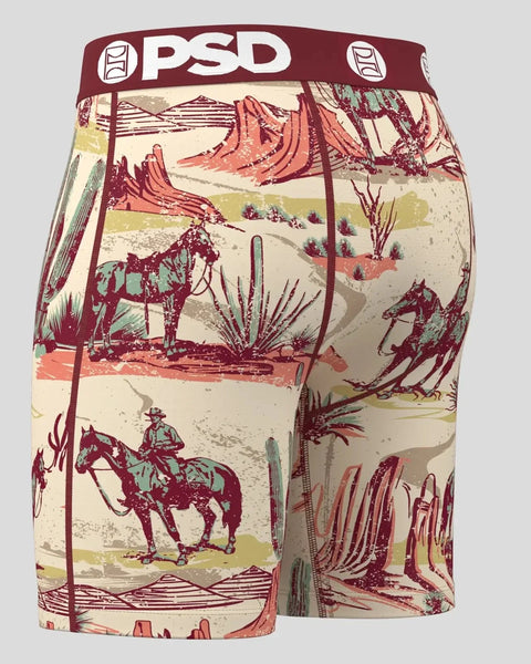 PSD boxer briefs with cream and burgundy western landscape print featuring cowboys, horses, cacti, and desert mountains.