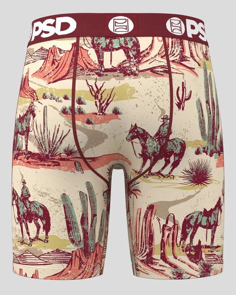 PSD boxer briefs with cream background featuring burgundy and multicolor western desert landscape illustrations including cac