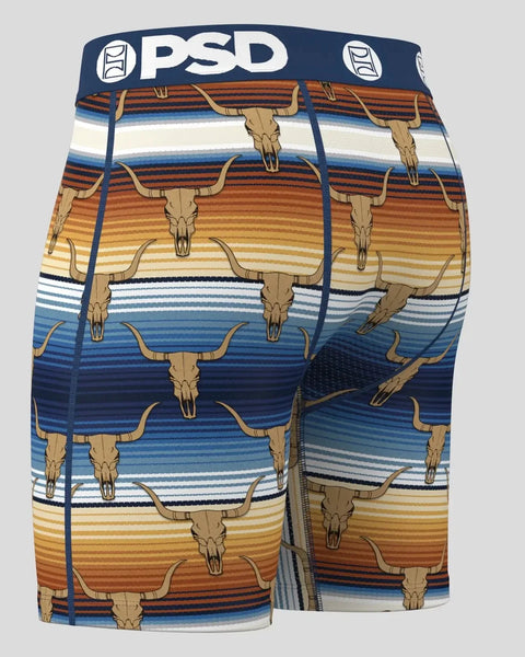 PSD brand shorts with longhorn skull print and horizontal stripes in blue, orange, and cream tones.