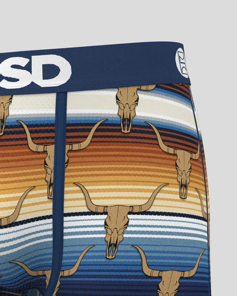 Navy waistband with white text and longhorn skull heads printed on striped fabric in orange, cream, and blue tones.