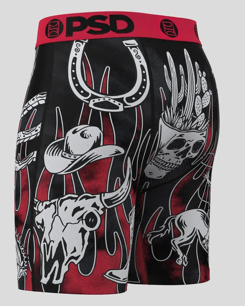 PSD shorts with red waistband and black fabric featuring white western-themed graphics including cowboy hat, horseshoe, and s