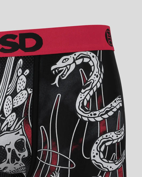 Black boxer briefs with red waistband featuring white snakes, skulls, and cactus graphic design.