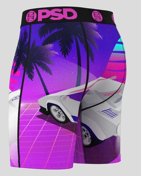 PSD boxer shorts with magenta and purple synthwave design featuring retro car, palm trees, and geometric grid pattern.