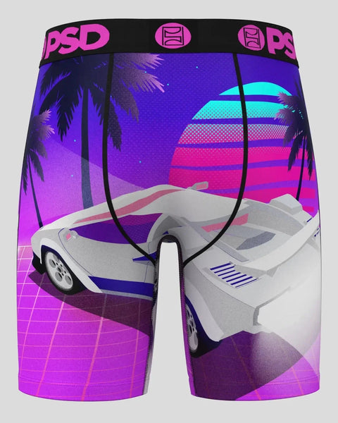 PSD boxer briefs with synthwave-themed print featuring white sports car, palm trees, and neon gradient sunset landscape.