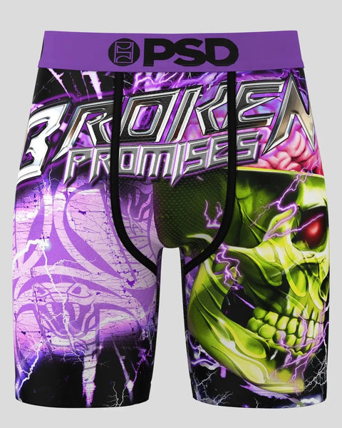 PSD boxer briefs with purple waistband, featuring neon skull graphic and "Broken Promises" text on black background.