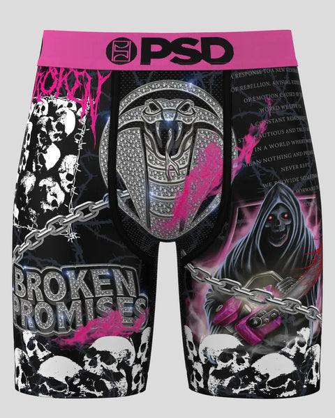PSD boxer briefs with black, white, and pink graphic print featuring skulls, chains, and ornate helmet design.