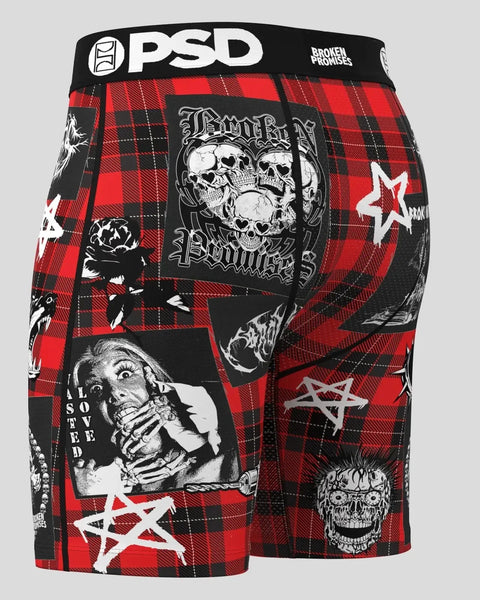 PSD Broken Promises Sabotage boxer shorts with red and black plaid pattern, skull graphics, and white star designs.