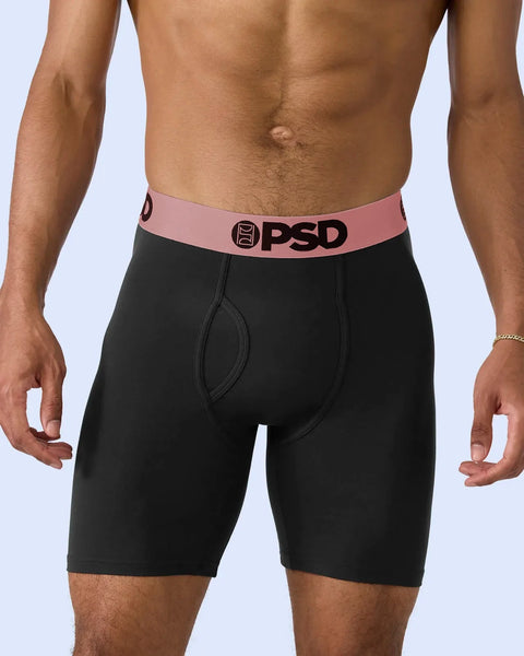Black boxer briefs with rose gold waistband and PSD logo.
