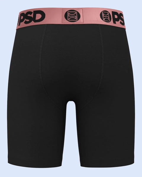 Black boxer briefs with rose gold PSD waistband featuring geometric logo pattern.