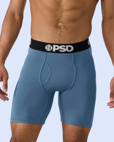 Teal modal boxer briefs with black PSD waistband and stitched pouch detail.