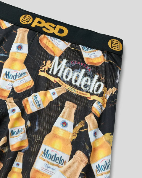 PSD underwear with Modelo beer bottle print and black background.