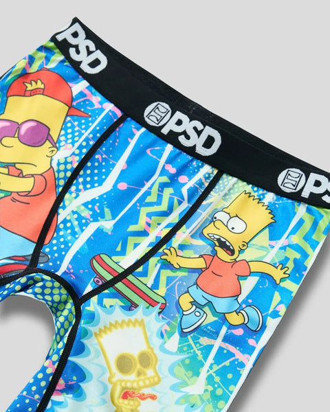 Boxer briefs with black waistband featuring Bart Simpson characters and colorful abstract patterns on blue background.