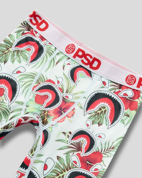 White briefs with red PSD waistband featuring repeating red and black monster mouths with green tropical leaves throughout.