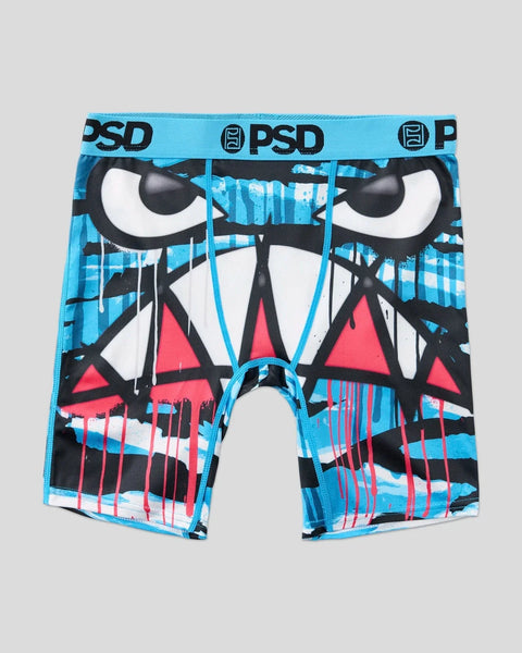 Blue PSD boxer briefs with black and white cartoon face design featuring large eyes and red triangular mouth accents.