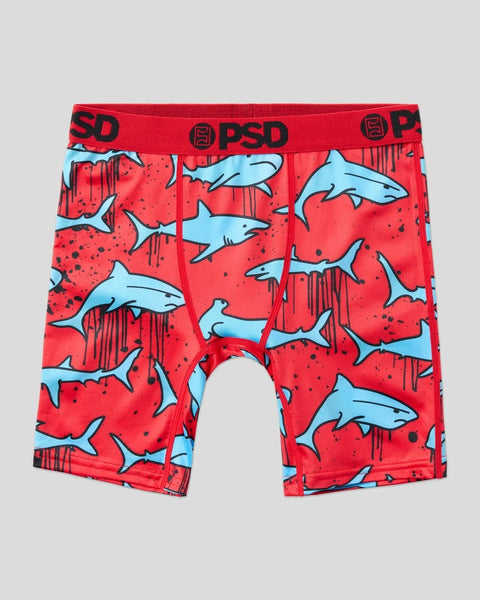 Red boxer briefs with blue shark print and PSD waistband.