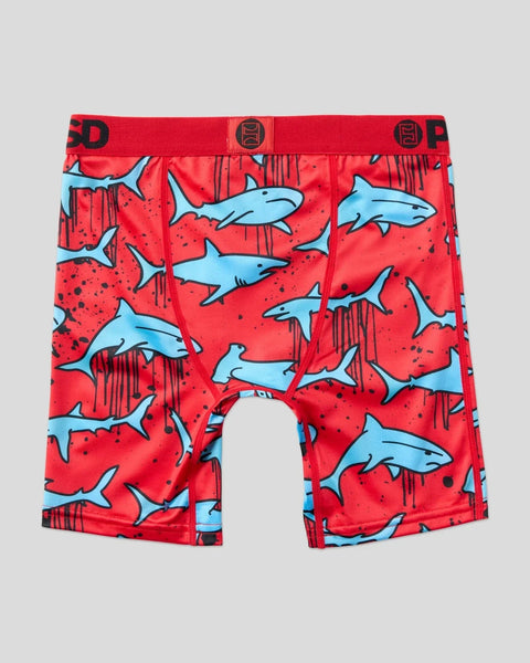 Red swim shorts with light blue shark and dark red vertical line pattern throughout.