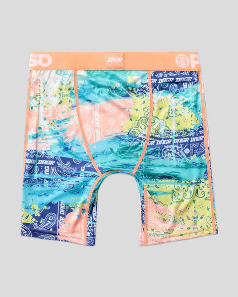 Boxer briefs with patchwork paisley and abstract patterns in blue, pink, yellow, and turquoise with orange waistband.