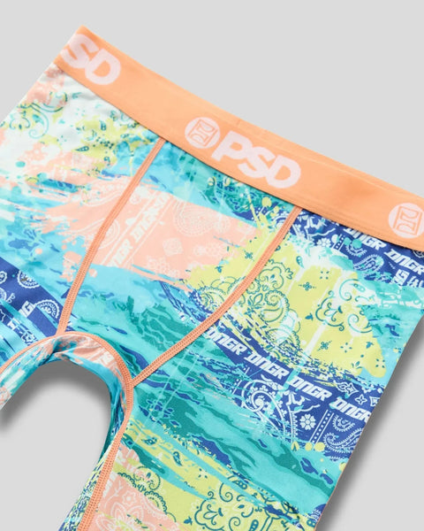Colorful paisley-patterned underwear with orange waistband and stitching in blue, yellow, and turquoise tones.