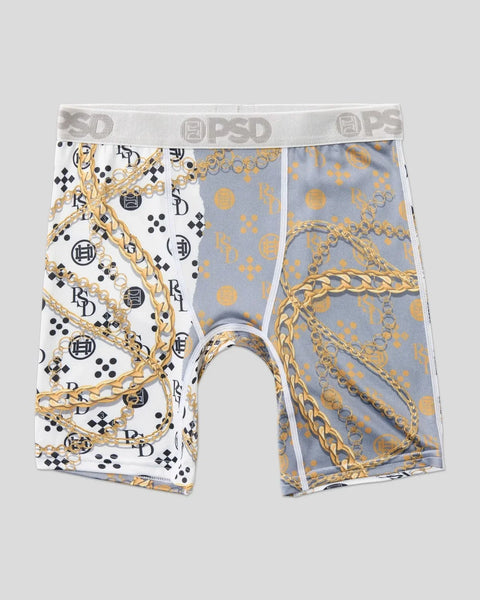 Men's boxer briefs with white left side featuring gold chains and black geometric patterns, blue right side with gold chain a