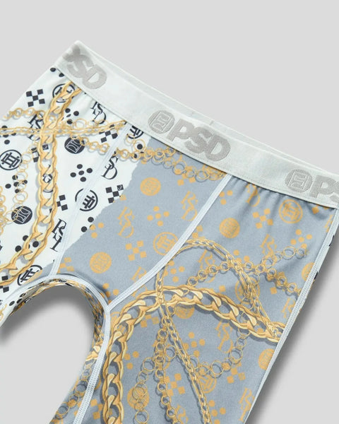 Men's boxer briefs with white waistband featuring gold chain and blue geometric patterns with black and white checkered desig