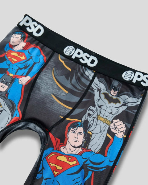 PSD underwear featuring Superman and Batman characters on black fabric with elastic waistband.