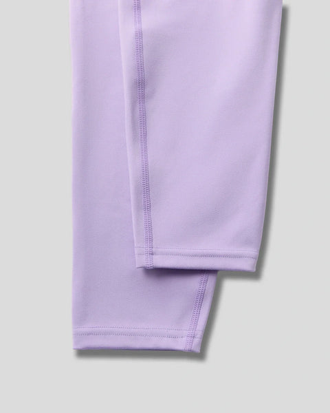 Lavender-colored leggings with flatlock seams and fitted hem detail.