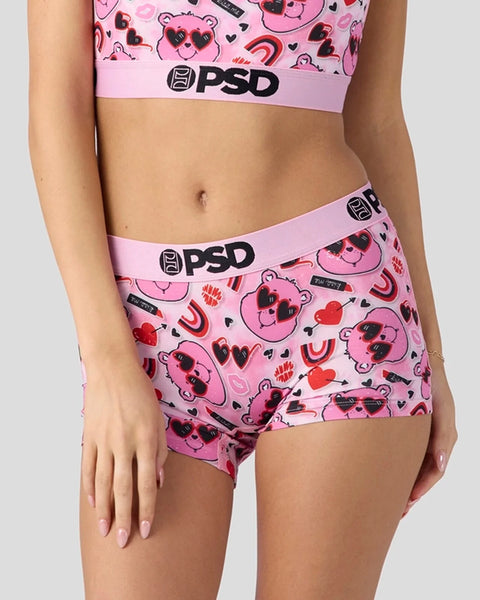 Pink PSD underwear and bra set with Care Bears print, hearts, and sunglasses design.